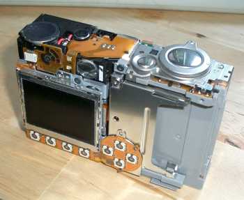 A Canon IXUS 400 without it's case on showing circuitry